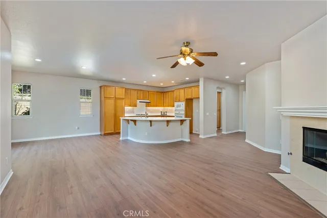 a view of a kitchen with a sink and a fireplace