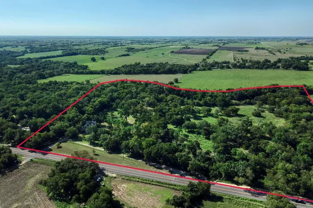 an aerial view of a houses with outdoor space and street view