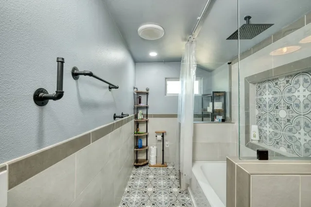 a bedroom with a bed and a television