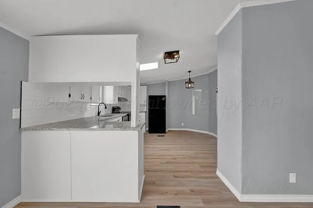 a view of a kitchen with a sink and a stove
