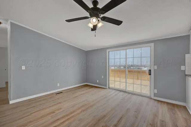 a view of an entryway with wooden floor