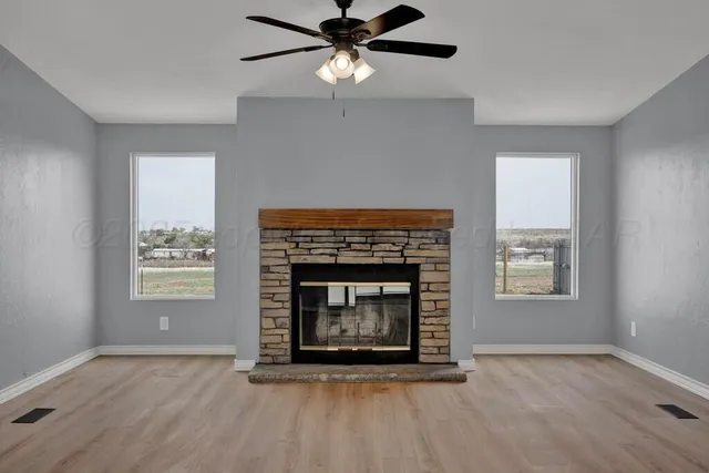 a room with wooden floor and a sink