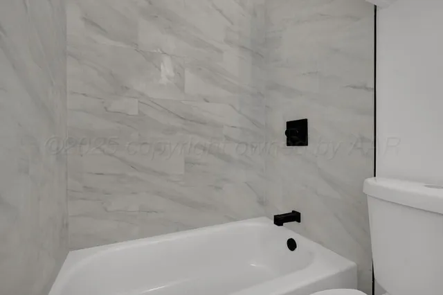 a bathroom with a bathtub