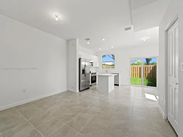 a view of kitchen and windows