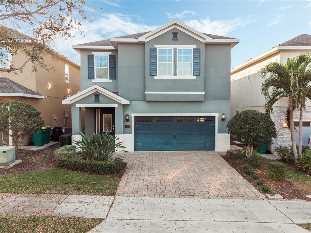 430 Novi Path Kissimmee, FL 34747 - Photo 1 of 1 a front view of a house with a yard and garage