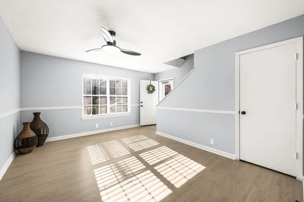 a view of an empty room with a window