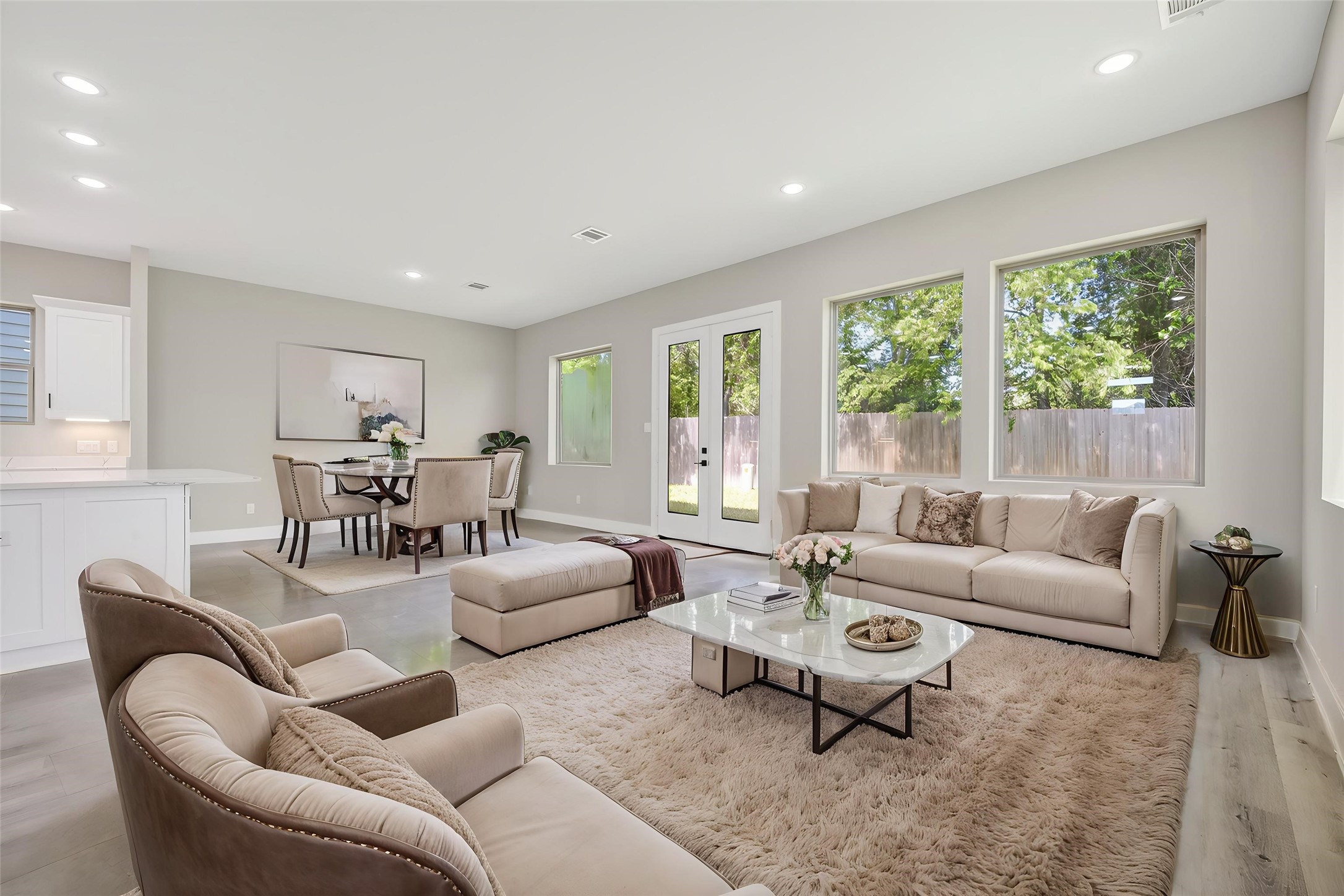 4930 Wunder Way Houston, TX 77069 - Photo 3 of 23 This AI-staged living space exudes modern elegance with its open layout, plush furnishings, and abundant natural light, creating a welcoming and serene atmosphere for any home buyer.