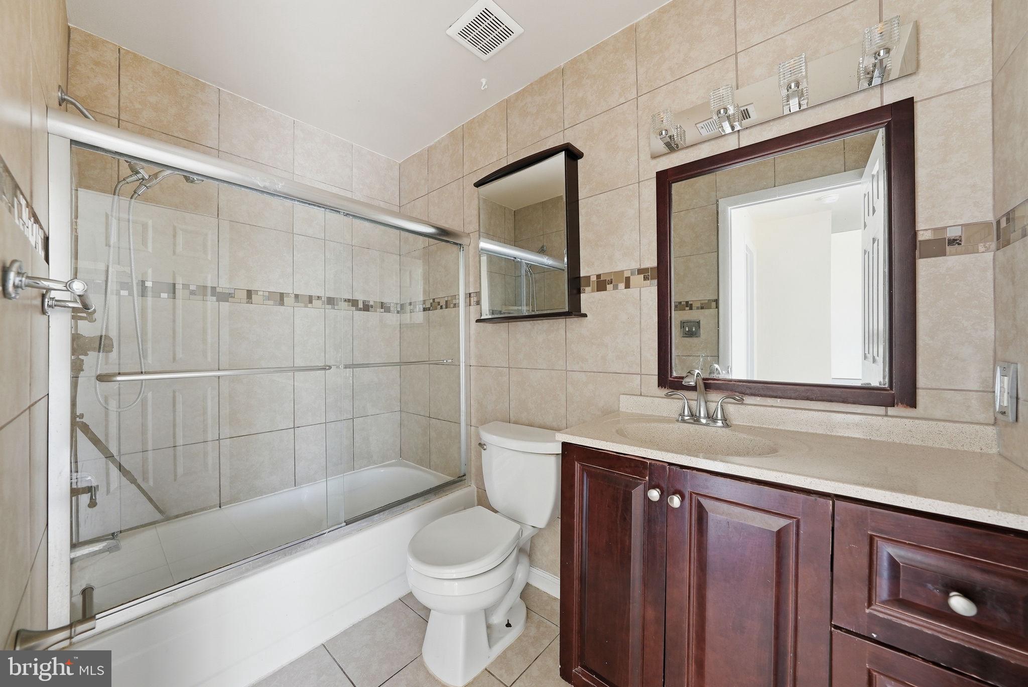 1003 Spring Valley Court Fort Washington, MD 20744 - Photo 18 of 25 a bathroom with a sink a toilet and shower