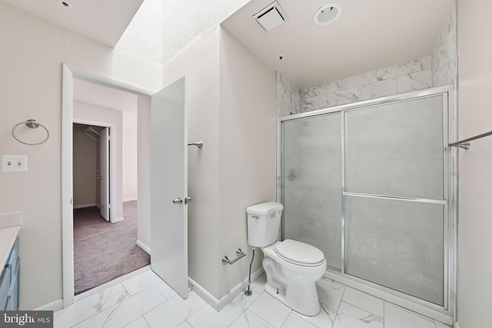 1003 Spring Valley Court Fort Washington, MD 20744 - Photo 20 of 25 a bathroom with a toilet a sink and shower