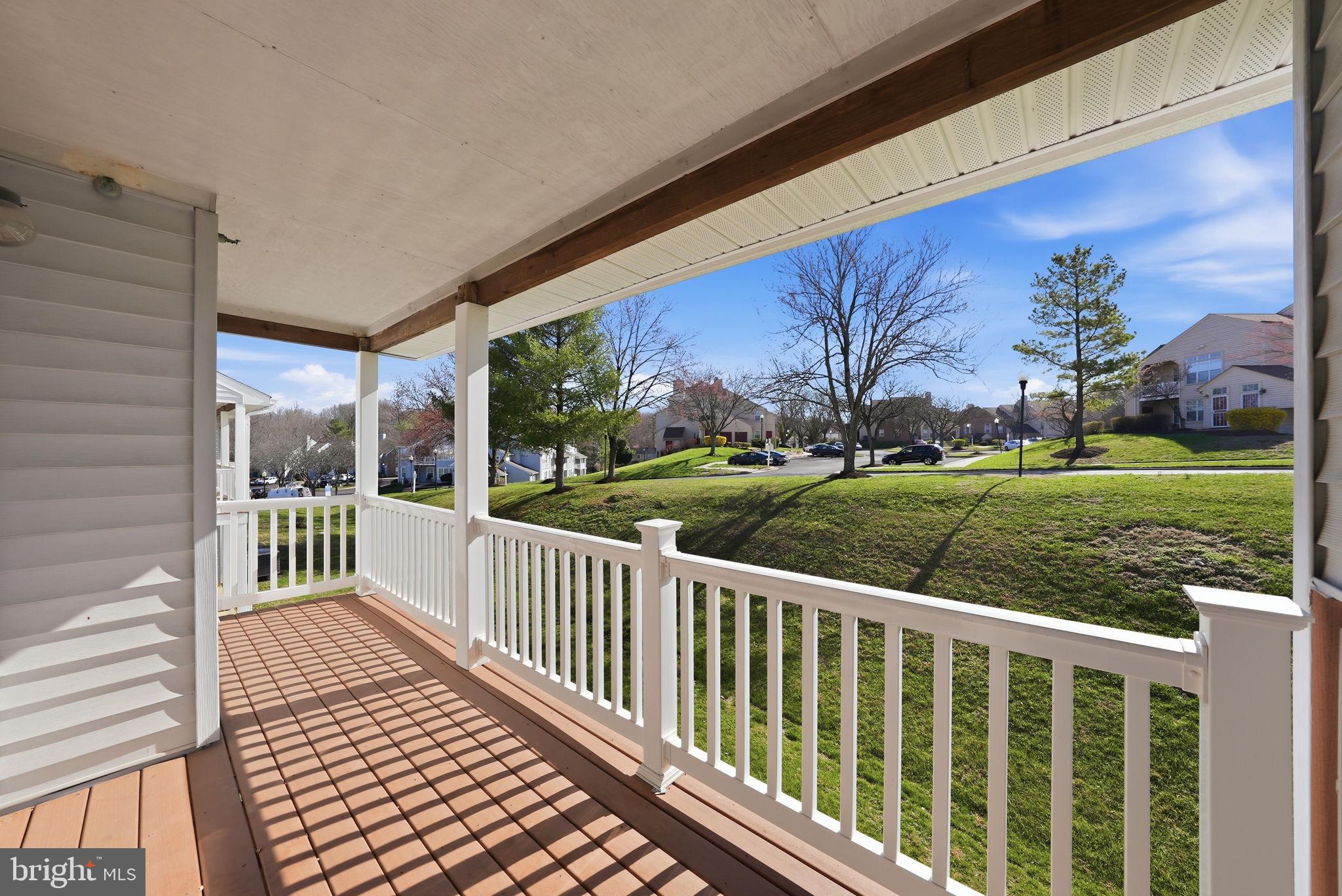 1003 Spring Valley Court Fort Washington, MD 20744 - Photo 23 of 25 a view of a porch with wooden floor and fence