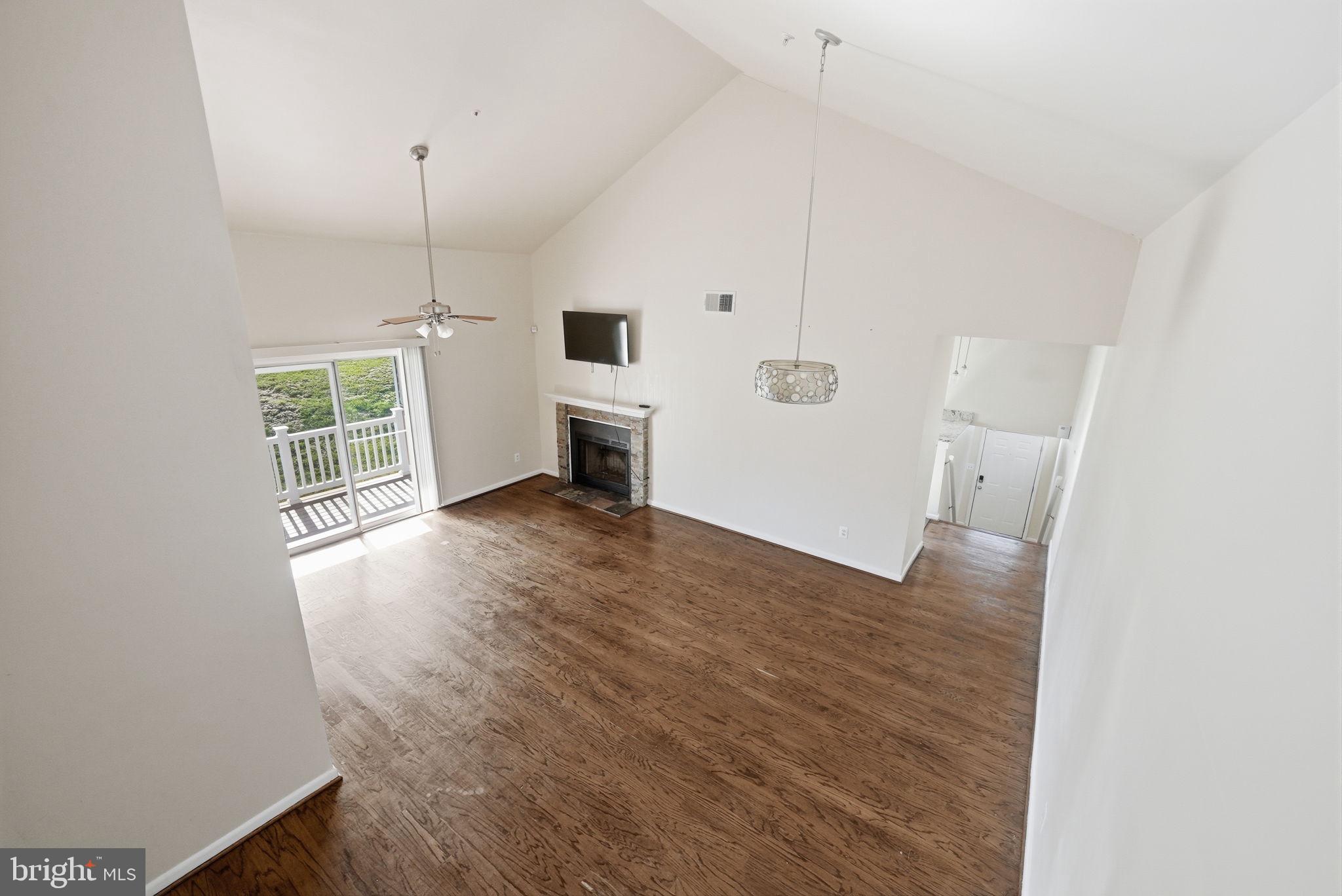 1003 Spring Valley Court Fort Washington, MD 20744 - Photo 5 of 25 a view of empty room with wooden floor and window