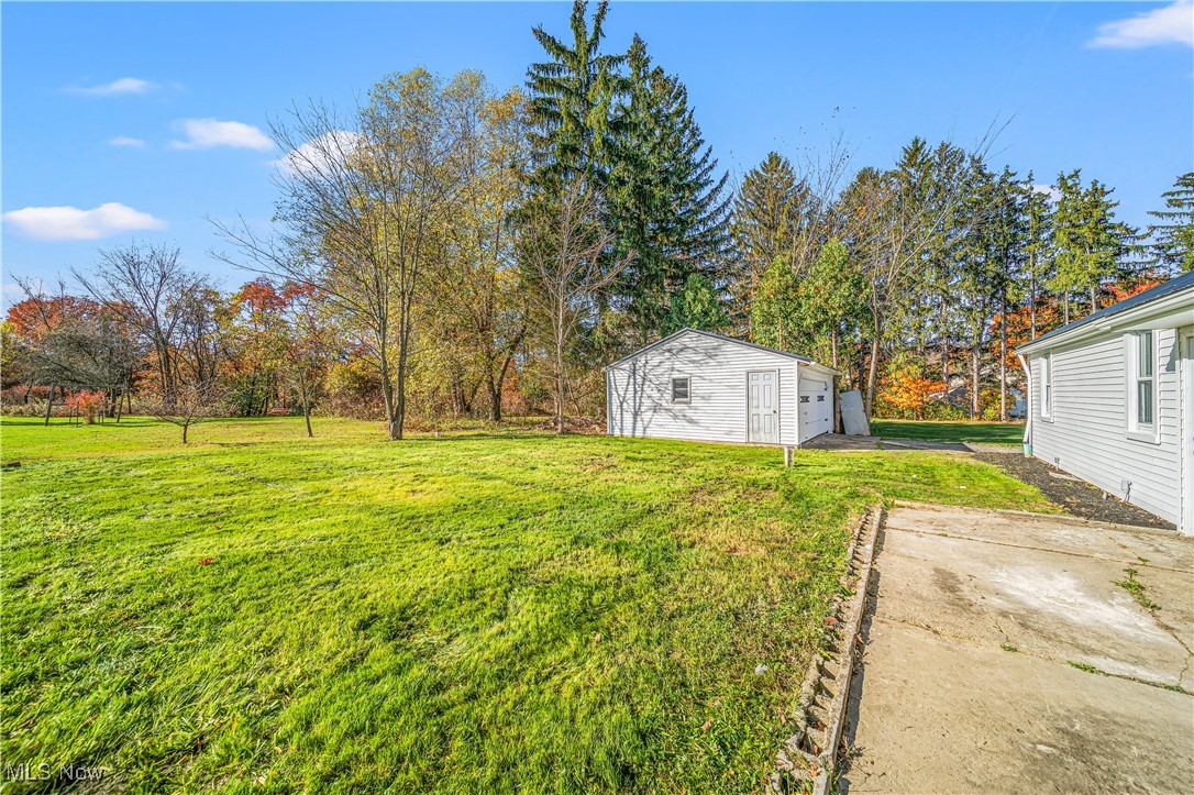 15245 Georgia Road Middlefield, OH 44062 - Photo 33 of 35 View of yard with a garage and an outdoor structure