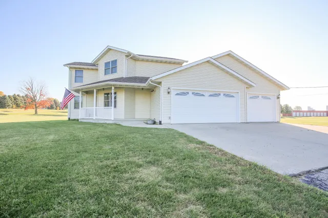 a view of an house with backyard space and garden