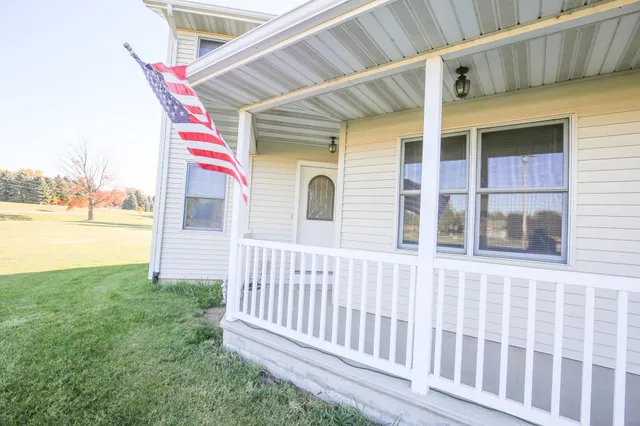 a view of empty room with wooden walls