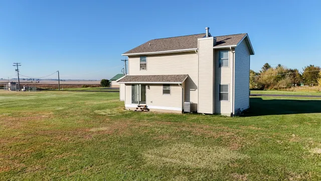 a view of a hallway with chairs