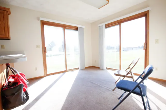 a view of workspace with furniture and a window