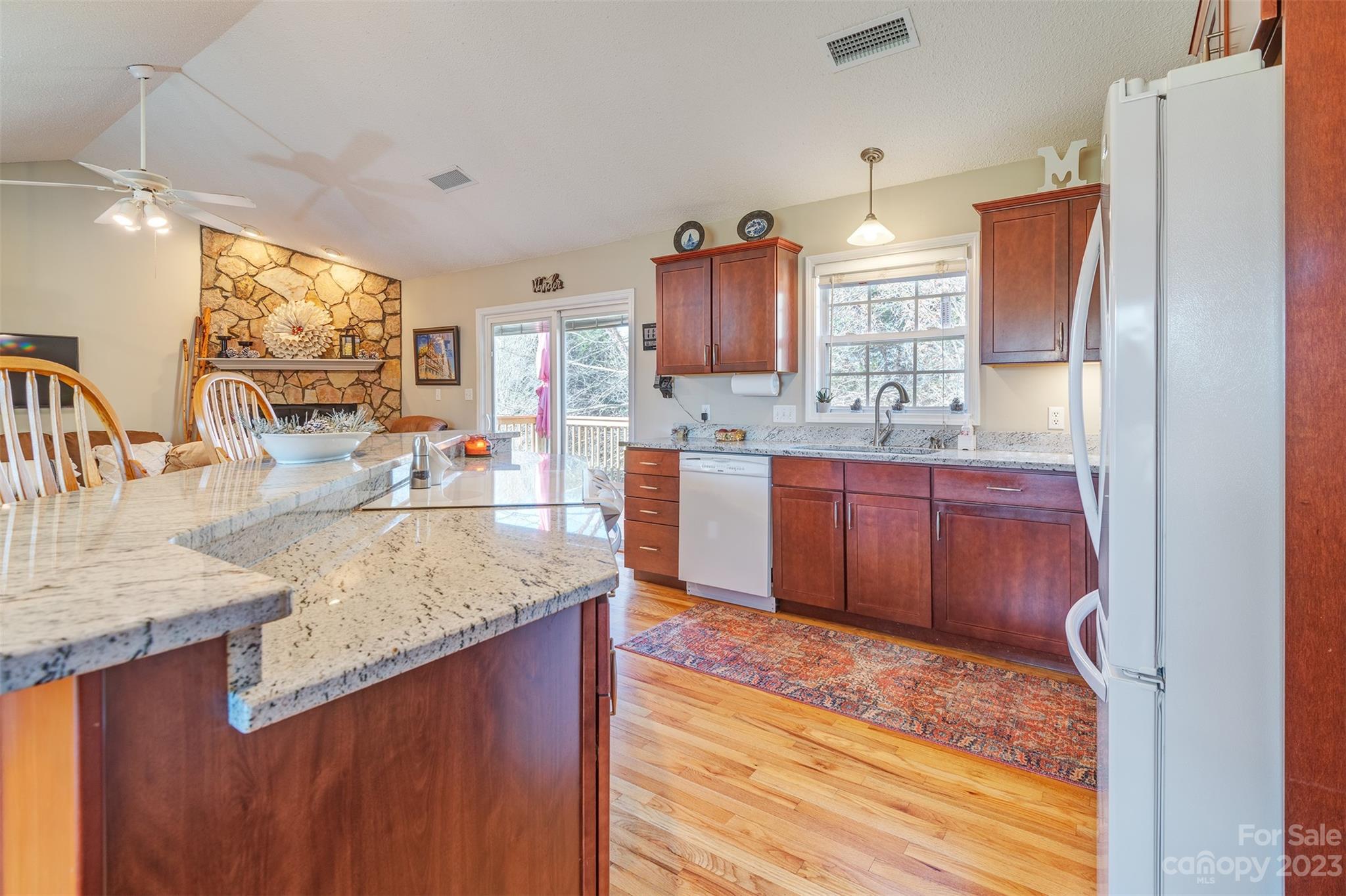 1315 Alexander Road Leicester, NC 28748 - Photo 12 of 28 a kitchen with stainless steel appliances granite countertop a sink stove and refrigerator