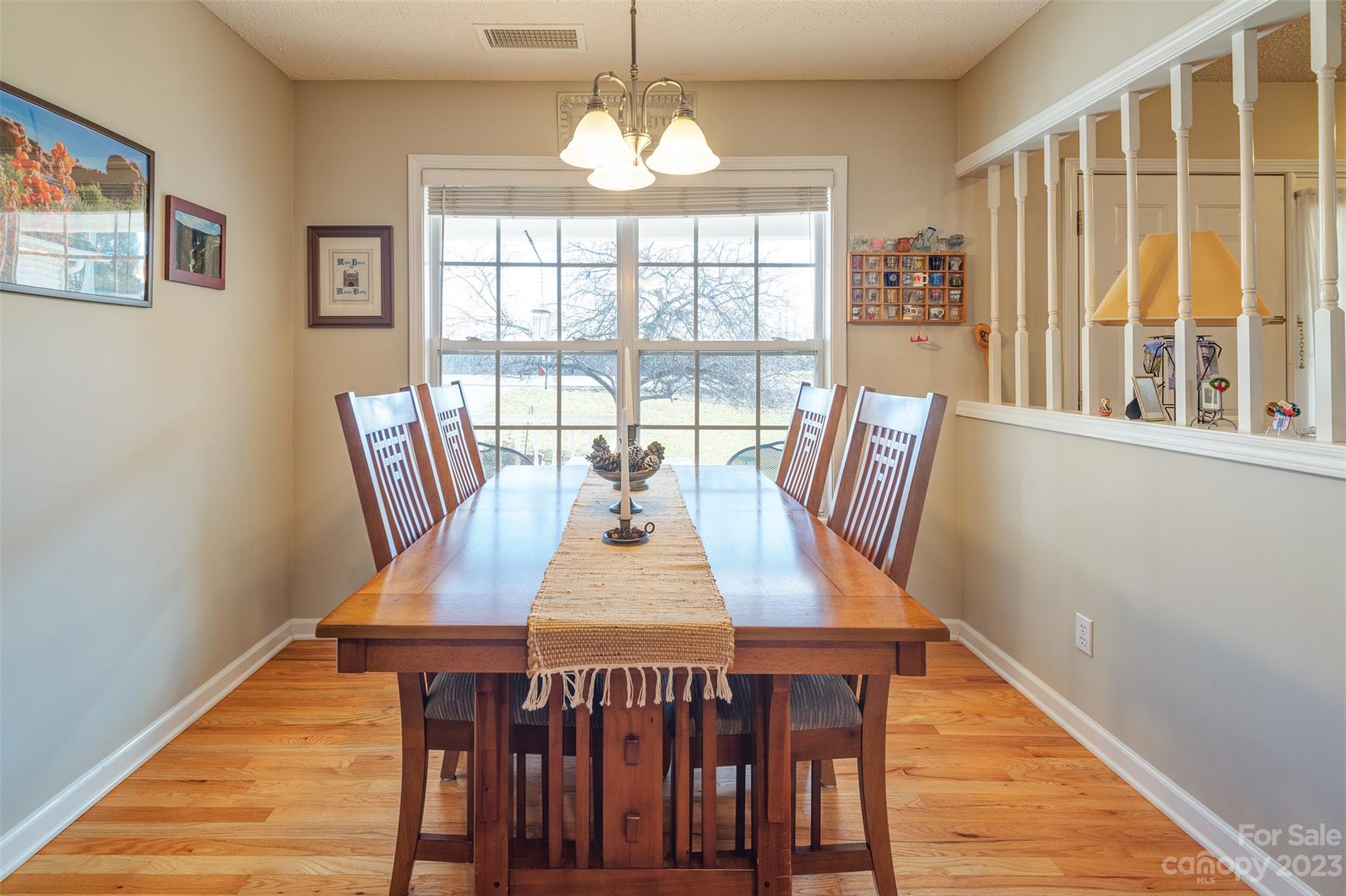1315 Alexander Road Leicester, NC 28748 - Photo 14 of 28 a view of a dining room with furniture window and wooden floor