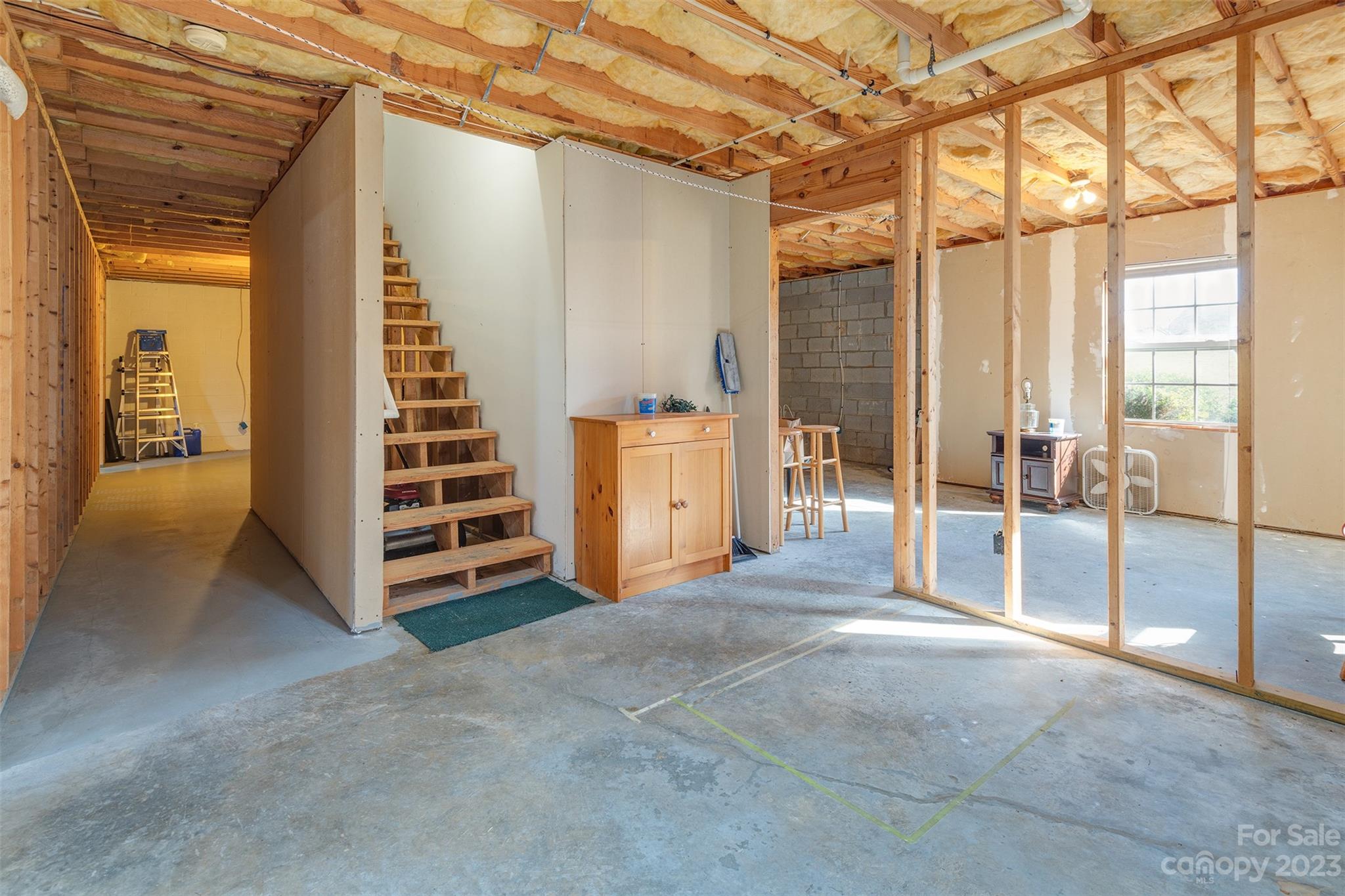 1315 Alexander Road Leicester, NC 28748 - Photo 21 of 28 a view of empty room with wooden floor and windows