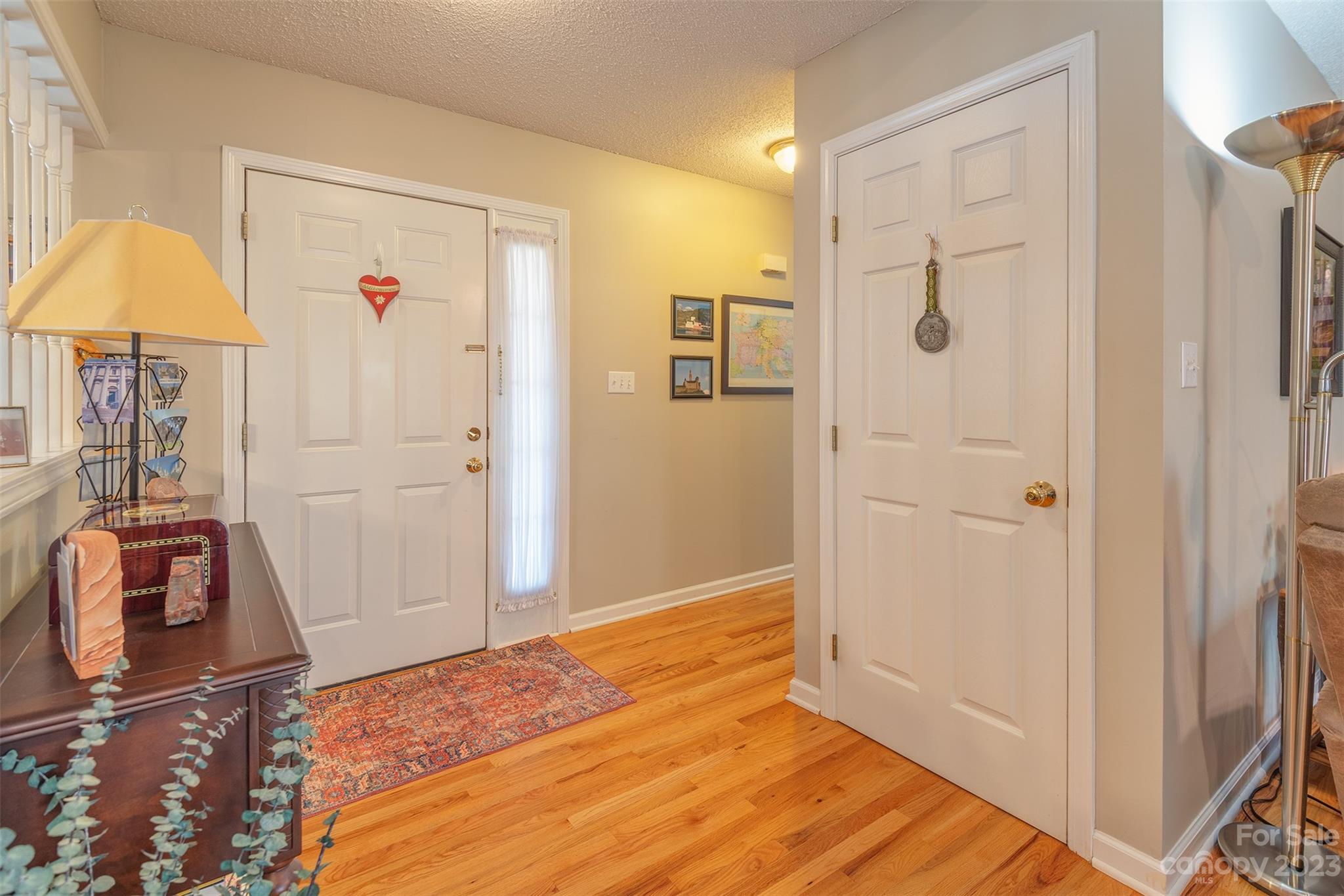 1315 Alexander Road Leicester, NC 28748 - Photo 4 of 28 a bedroom with a bed and wooden floor