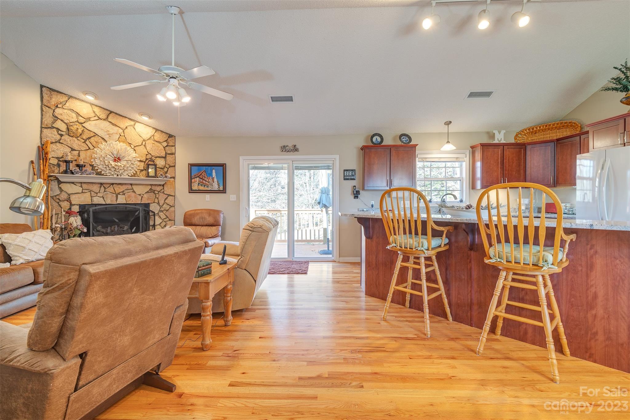 1315 Alexander Road Leicester, NC 28748 - Photo 5 of 28 a living room with furniture a flat screen tv and a floor to ceiling window