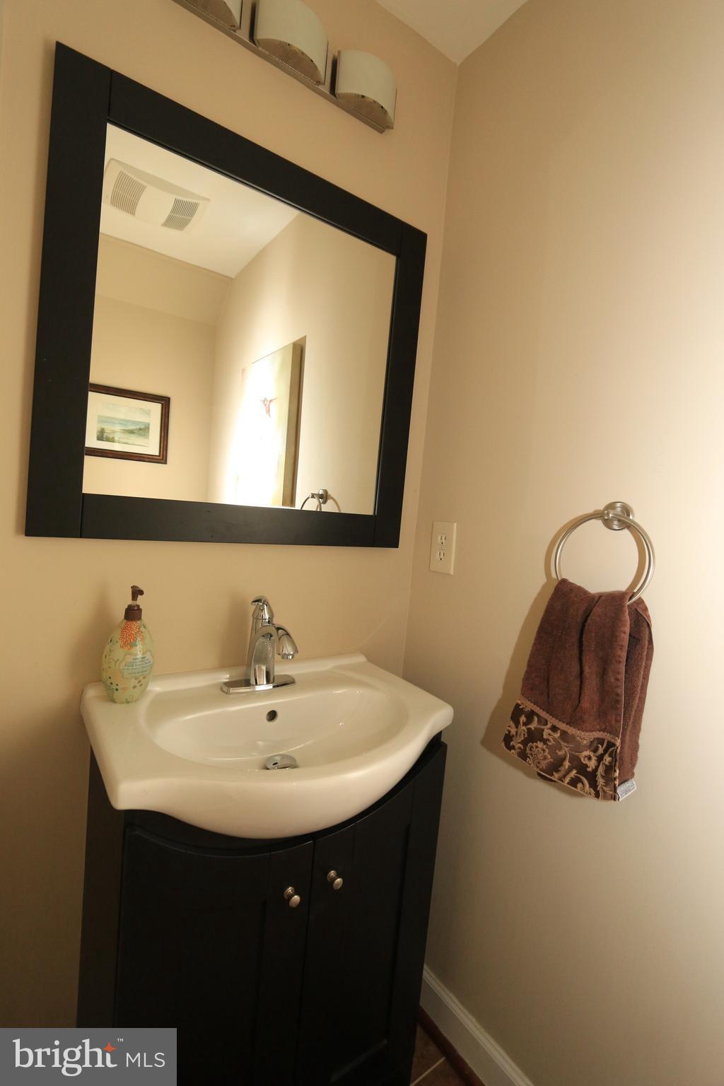 1535 Poplar Grove Drive Reston, VA 20194 - Photo 8 of 30 Powder Room with new mirror, lighting + vanity