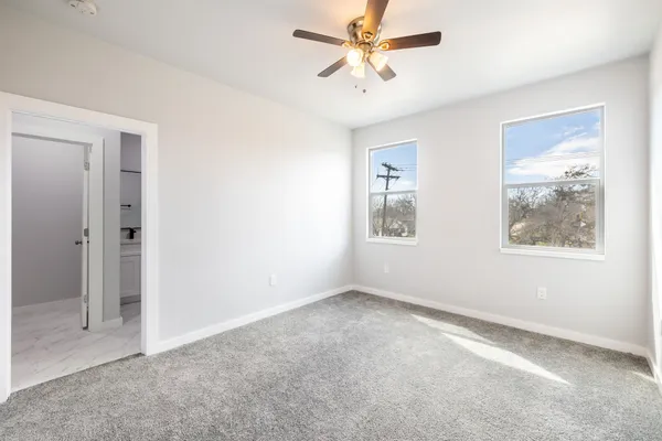 a view of an empty room with a window