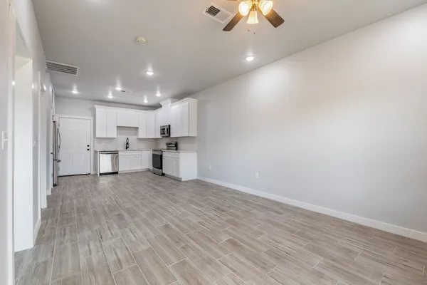 a view of kitchen with wooden floor