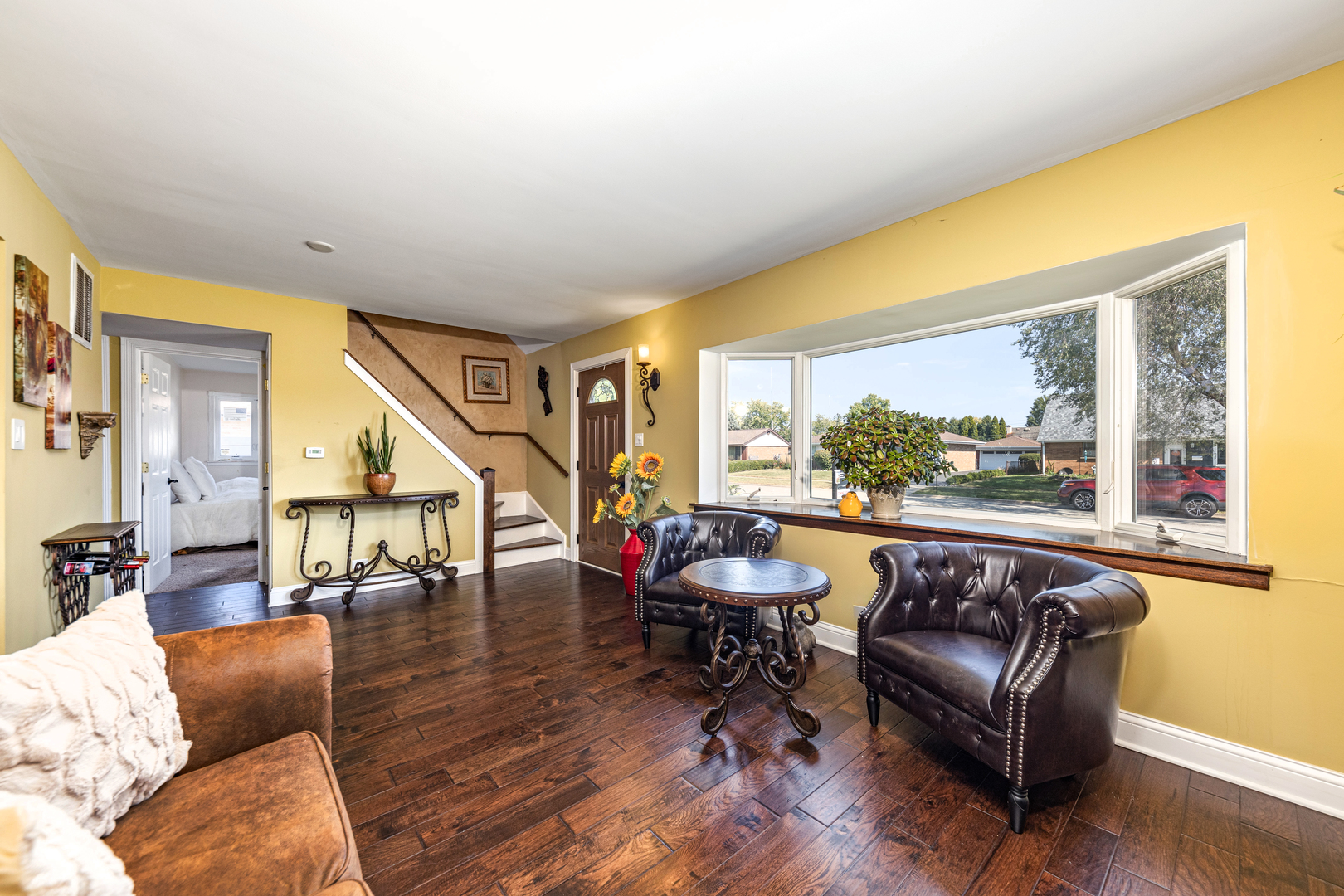 9236 Pembroke Lane Bridgeview, IL 60455 - Photo 14 of 40 a living room with furniture and a large window