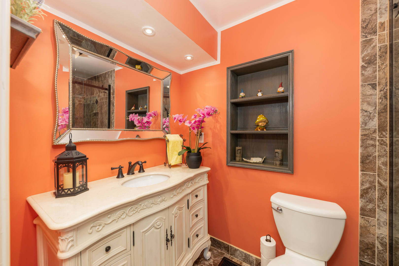 9236 Pembroke Lane Bridgeview, IL 60455 - Photo 25 of 40 a bathroom with a sink a mirror and a toilet