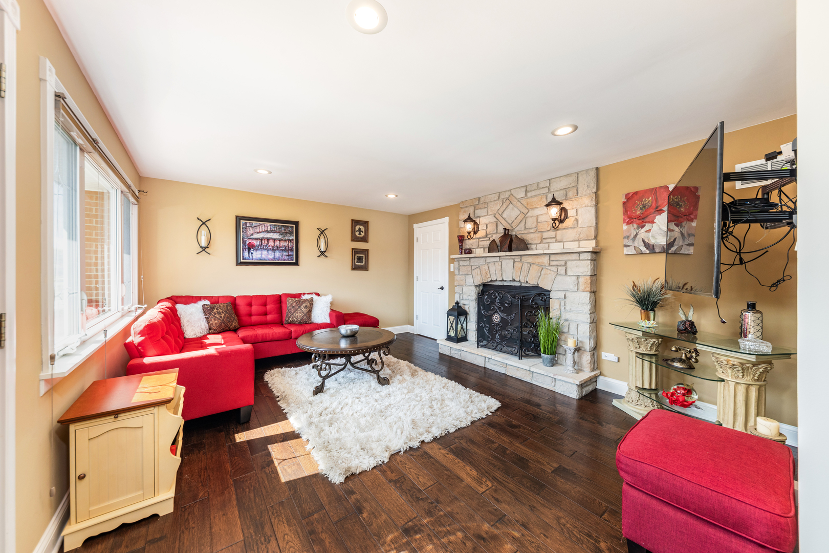 9236 Pembroke Lane Bridgeview, IL 60455 - Photo 10 of 40 a living room with furniture and a fireplace