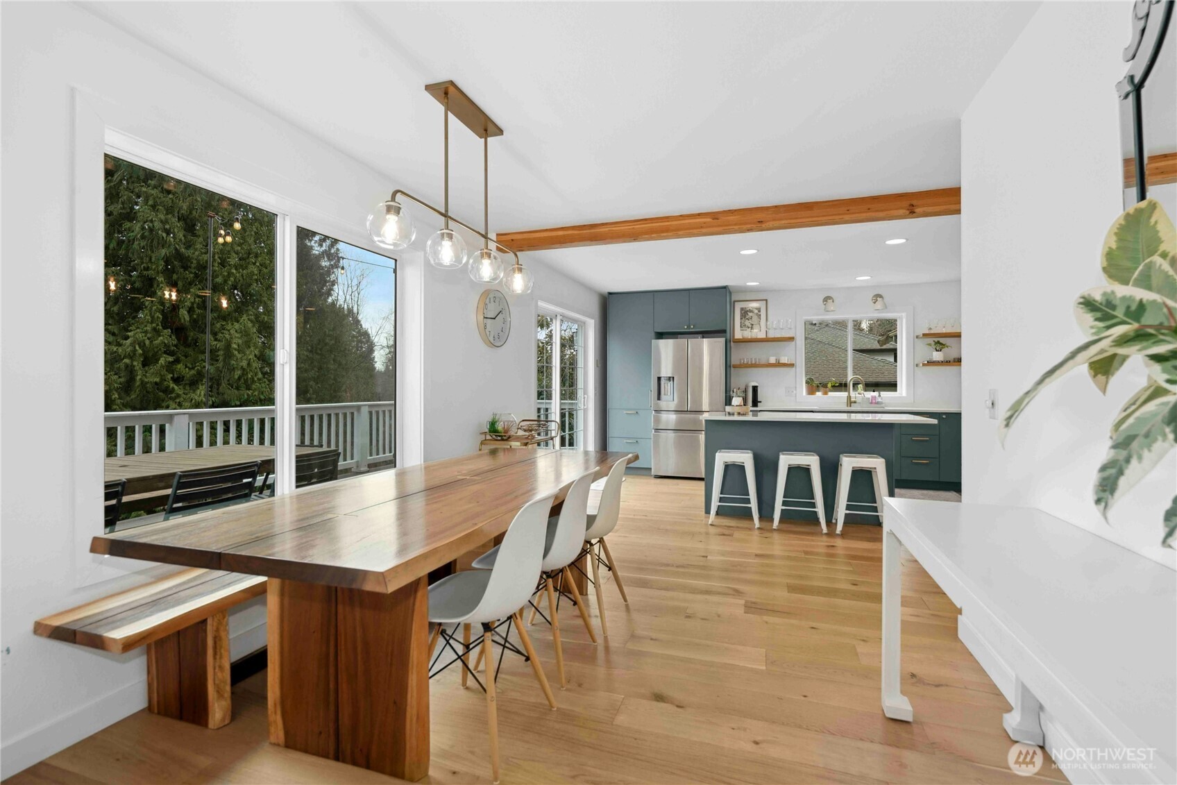 22629 4th Avenue Southeast Bothell, WA 98021 - Photo 6 of 29 a dining room with wooden floor a glass table and chairs