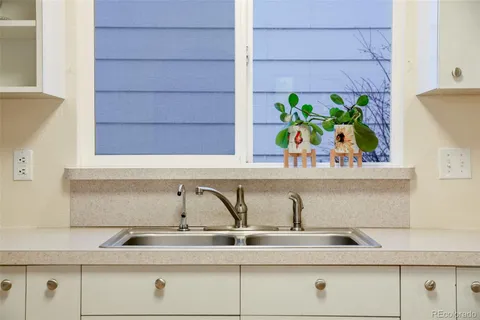 a view of a sink and wooden floor