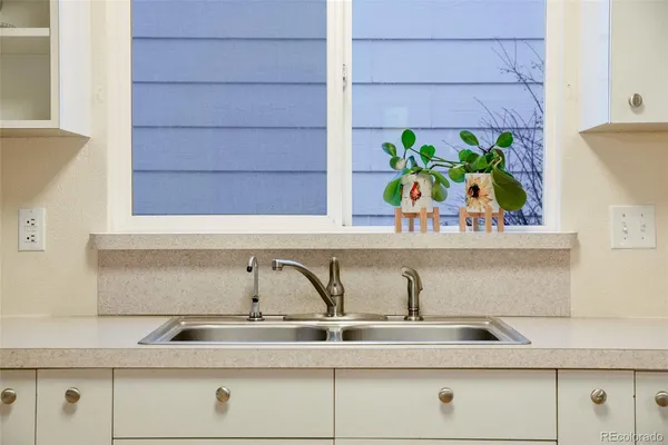 a view of a sink and wooden floor