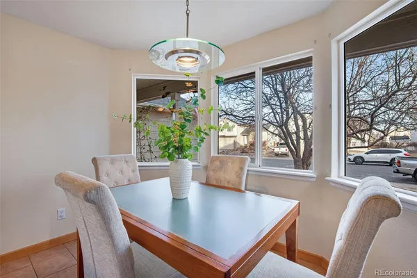 a view of a dining room with furniture window and outside view