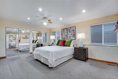 a spacious bedroom with a bed and window