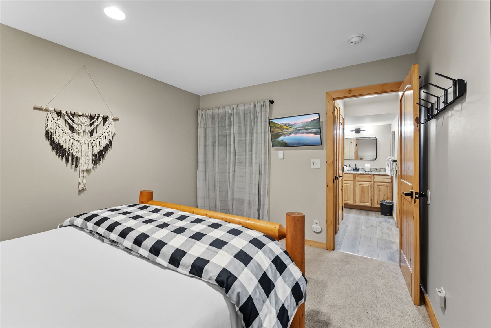 325 Four O Clock Road North, Unit B103 Breckenridge, CO 80424 - Photo 11 of 19 a bedroom with a bed and a view of bathroom