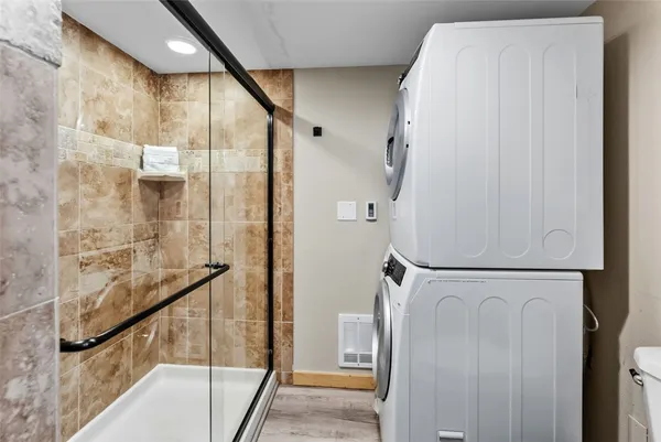 a bathroom with a bathtub and a shower
