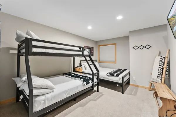 a bedroom with furniture and a window