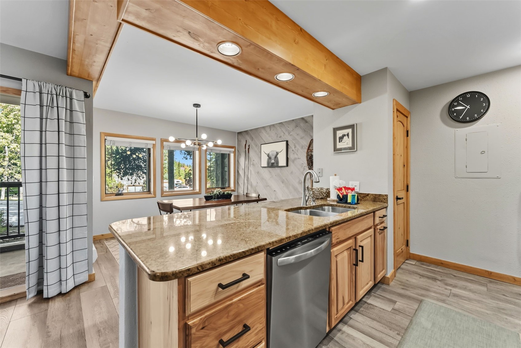 325 Four O Clock Road North, Unit B103 Breckenridge, CO 80424 - Photo 2 of 19 a kitchen with stainless steel appliances granite countertop a sink and a wooden floors