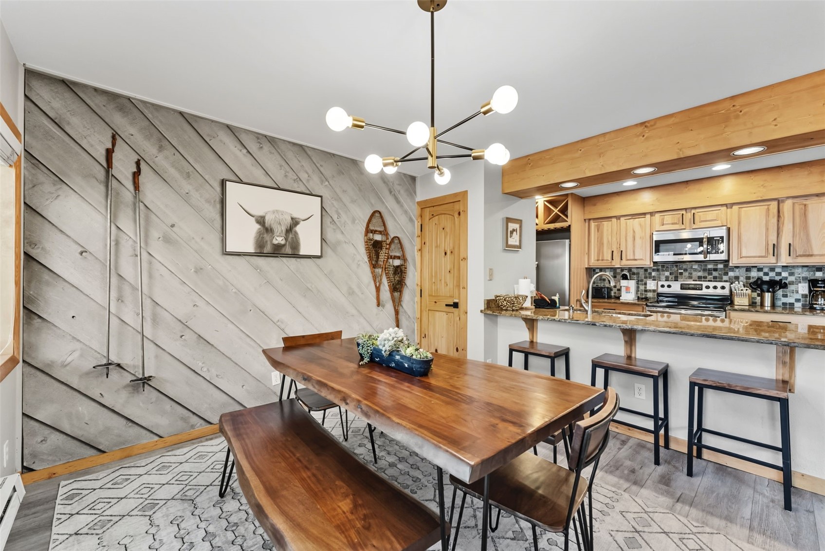 325 Four O Clock Road North, Unit B103 Breckenridge, CO 80424 - Photo 6 of 19 a dining room with furniture and window