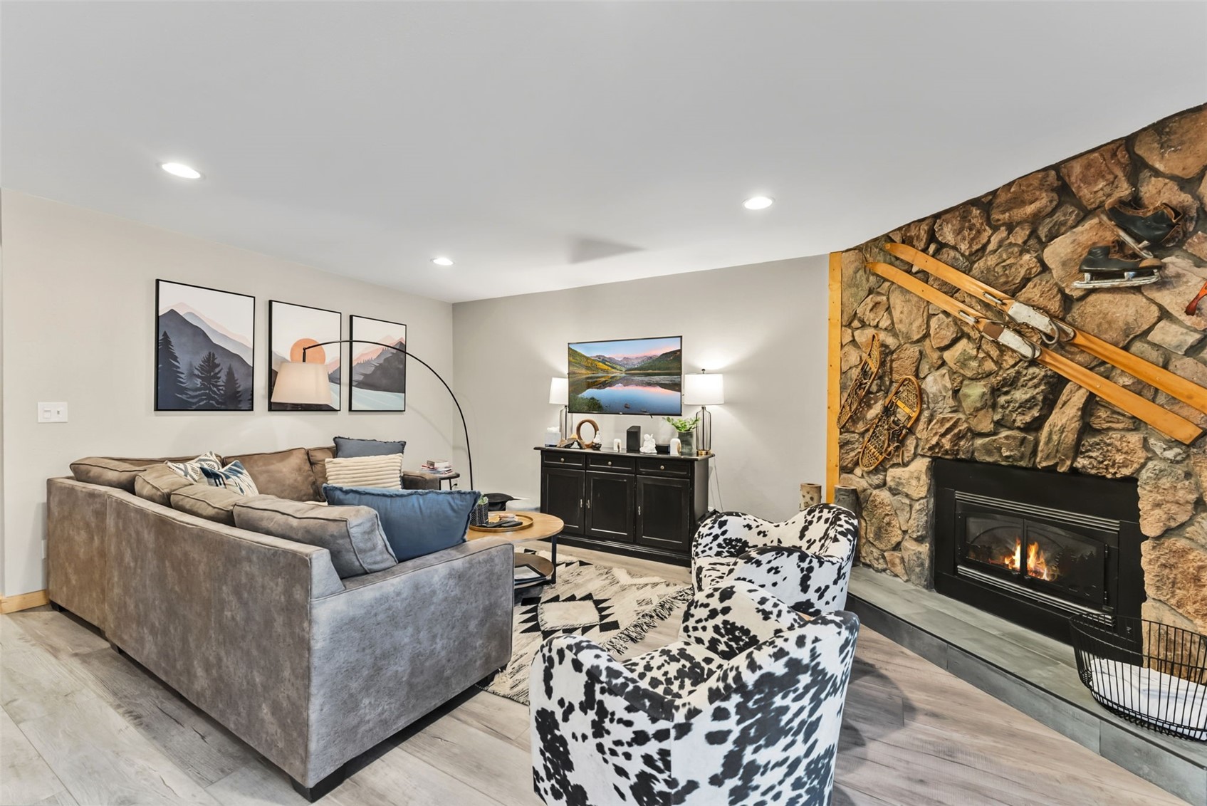 325 Four O Clock Road North, Unit B103 Breckenridge, CO 80424 - Photo 7 of 19 a living room with furniture a flat screen tv and a fireplace