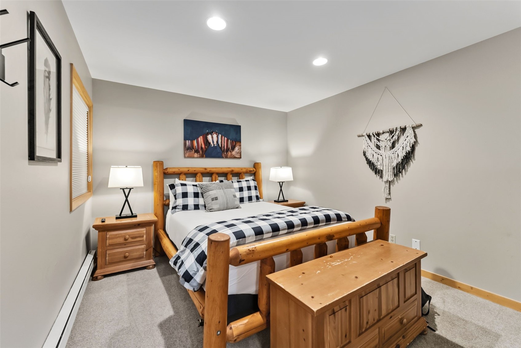 325 Four O Clock Road North, Unit B103 Breckenridge, CO 80424 - Photo 10 of 19 a bedroom with a bed and a chandelier