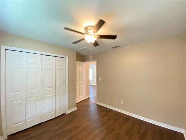 a view of an empty room and wooden floor