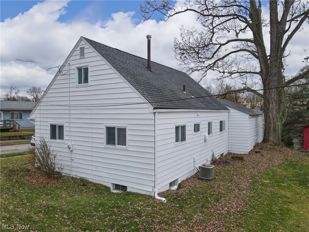 1466 Scenic Way Akron, OH 44310 - Photo 31 of 35 View of side of property with a lawn and central air condition unit