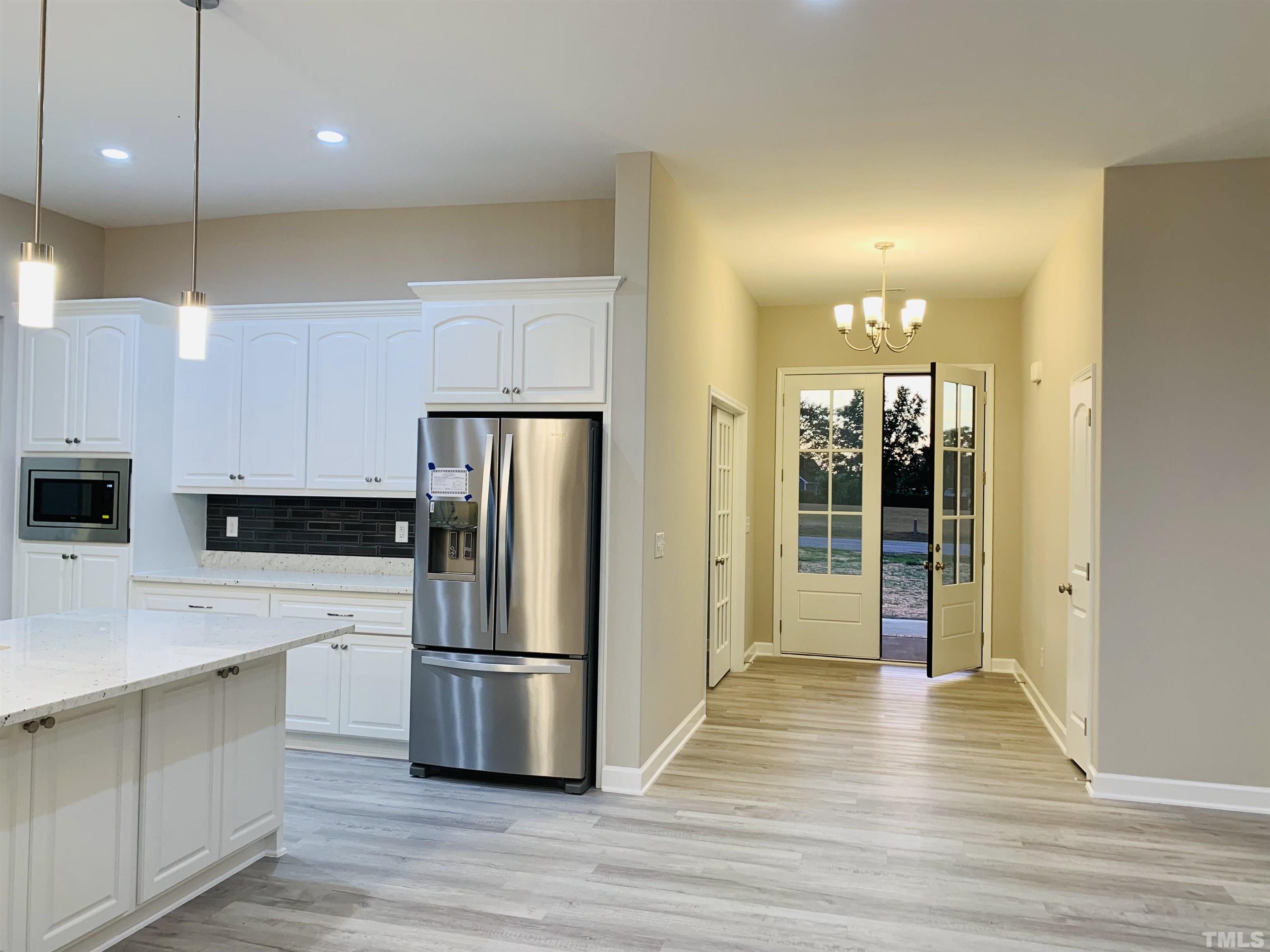 98 Crownview Lane Dunn, NC 28334 - Photo 5 of 5 a kitchen with stainless steel appliances a refrigerator and a stove top oven