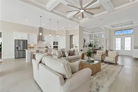 a living room with furniture white walls and white walls