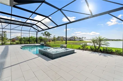 a view of swimming pool with a patio