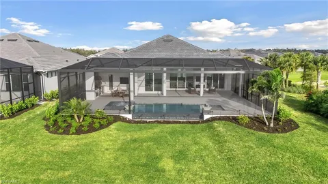 a front view of a house with a yard table and chairs