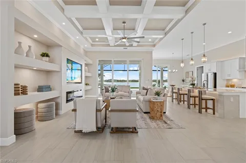 a large room with lots of white furniture